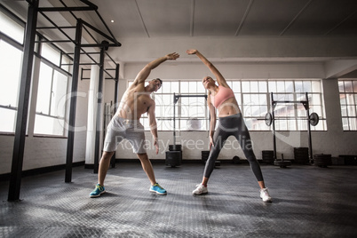 Two fit people doing fitness