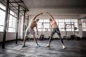 Two fit people doing fitness