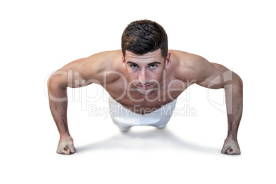 Man doing push up with clenched fist