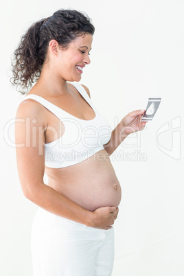 Pregnant woman looking at ultrasound scan