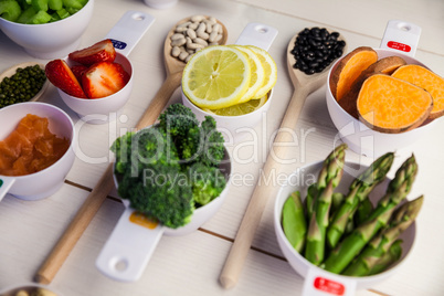 Portion cups and spoons of healthy ingredients