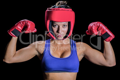 Portrait of female fighter with gloves and headgear