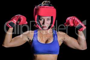 Portrait of female fighter with gloves and headgear