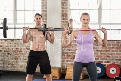 Two fit people working out