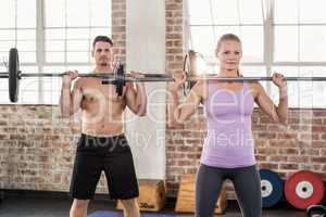 Two fit people working out