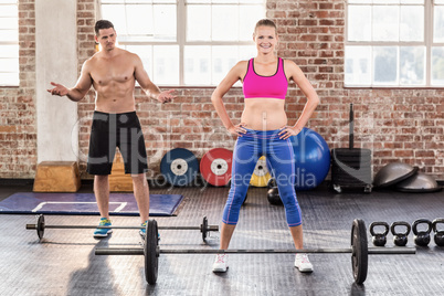 Two fit people working out