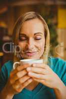 Young woman holding coffee cup