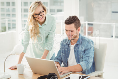 Smiling young man and woman wearing eyeglasses