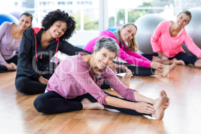 Portrait of fit women smiling while exercising