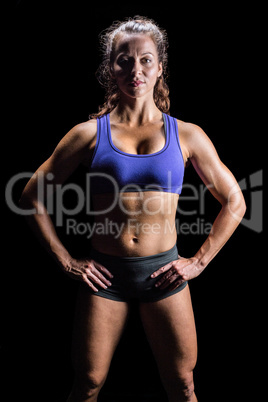 Portrait of confident woman with hands on hip