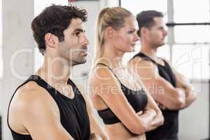 Fit people posing in gym