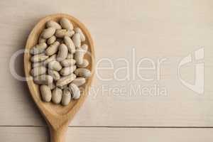 Wooden spoon of lima beans