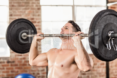 Muscular man doing weightlifting in crossfit
