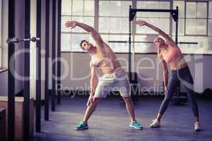 Two fit people doing fitness