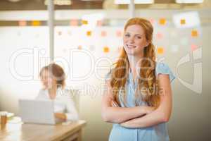 Businesswoman standing with arms crossed