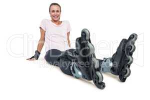 Portrait of cheerful female inline skater relaxing
