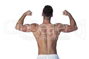 Rear view of muscular man showing biceps