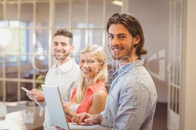 Portrait of happy business people working