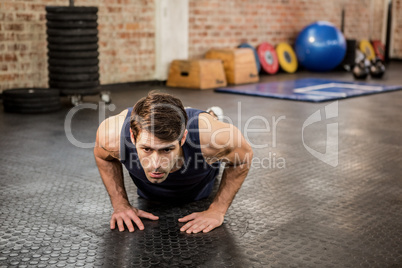 Handsome man doing diamond push ups