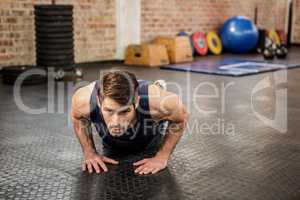 Handsome man doing diamond push ups