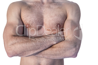 Midsection of a man with arms crossed