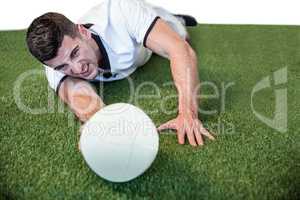 Man lying down while holding ball