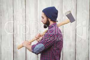 Side view of hipster with axe