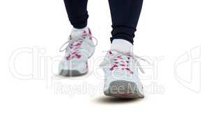 Low section of woman wearing shoes
