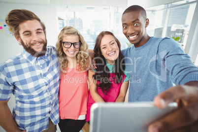 Smiling business people making face for selfie