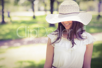 Smiling young woman in sun hat