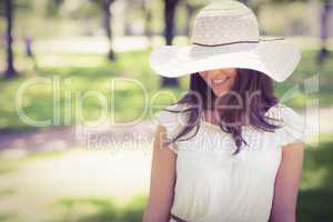 Smiling young woman in sun hat