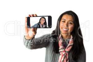 Smiling woman about to take a selfie