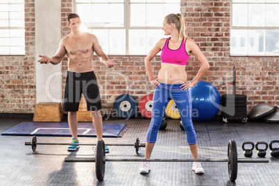 Two fit people working out