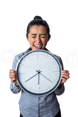 Happy woman showing her large clock