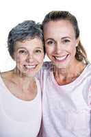 Close-up portrait of cheerful mother and daughter