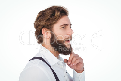 Thoughtful hipster with finger on chin