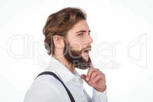 Thoughtful hipster with finger on chin
