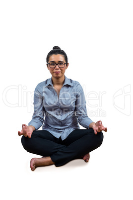 Woman meditating with her legs crossed