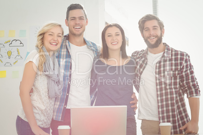 Portrait of smiling business people standing with arm around