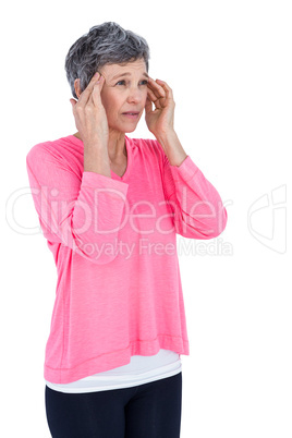 Mature woman massaging head