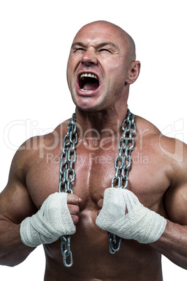 Aggressive bodybuilder holding chain