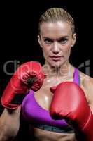 Portrait of female boxer with gloves