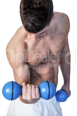 Shirtless man holding dumbbells