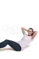 Portrait of cheerful sporty woman doing sit ups