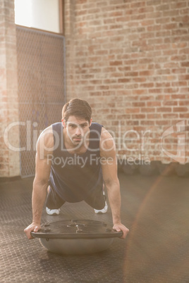 Man doing bosu push ups