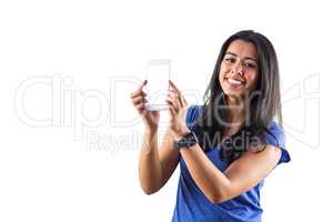 Smiling woman using a smartphoen and wearing a smartwatch