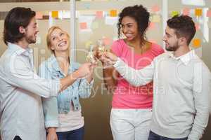 Colleagues toasting champagne in party