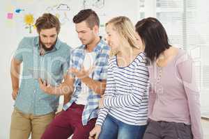 Man holding digital tablet gesturing