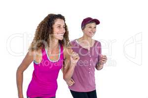 Happy female friends jogging