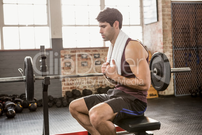 Focused man sitting on bench